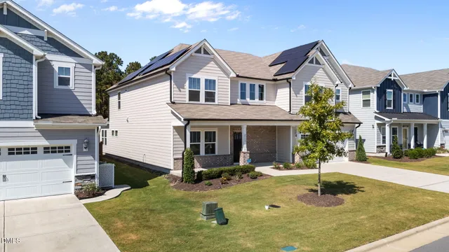 a front view of a house with yard