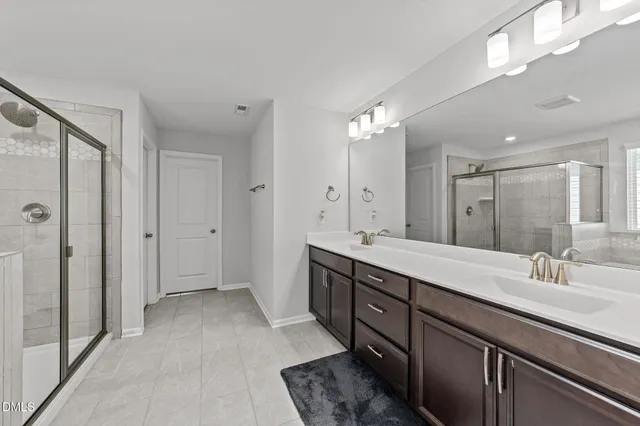 a living room with baby toys and chandelier fan