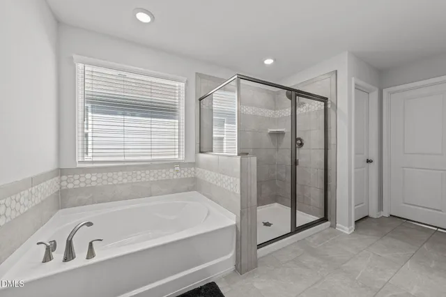a view of room with toys and ceiling fan