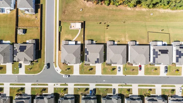 an aerial view of a house with a swimming pool