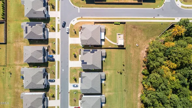 an aerial view of a house with swimming pool