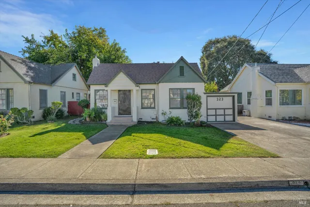 a front view of a house with garden