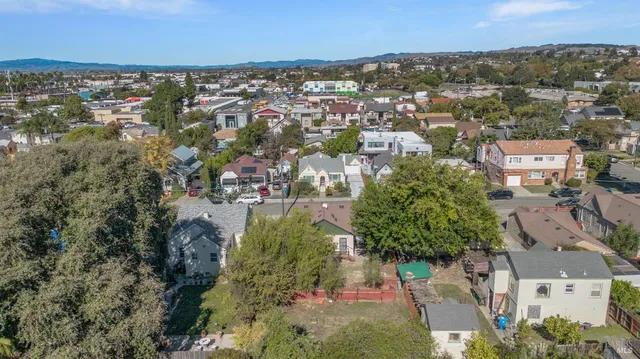 an aerial view of residential building with green space