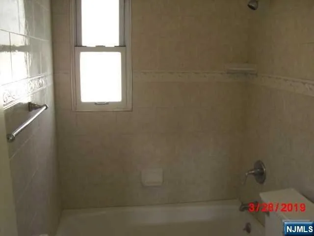 a bath room with a window