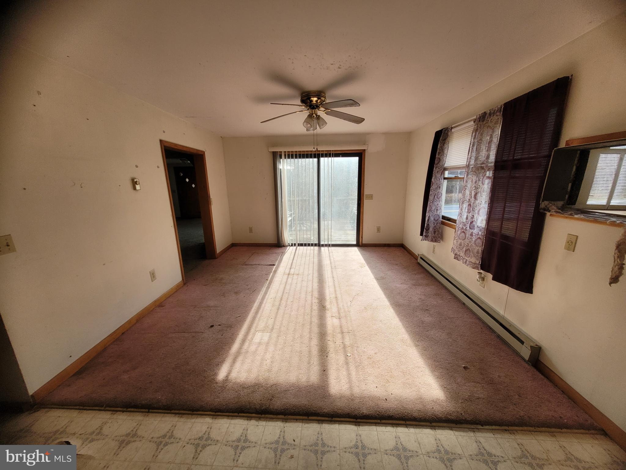 9492 Cumberland Road Springfield, WV 26763 - Photo 13 of 33 wooden floor in an empty room with a window