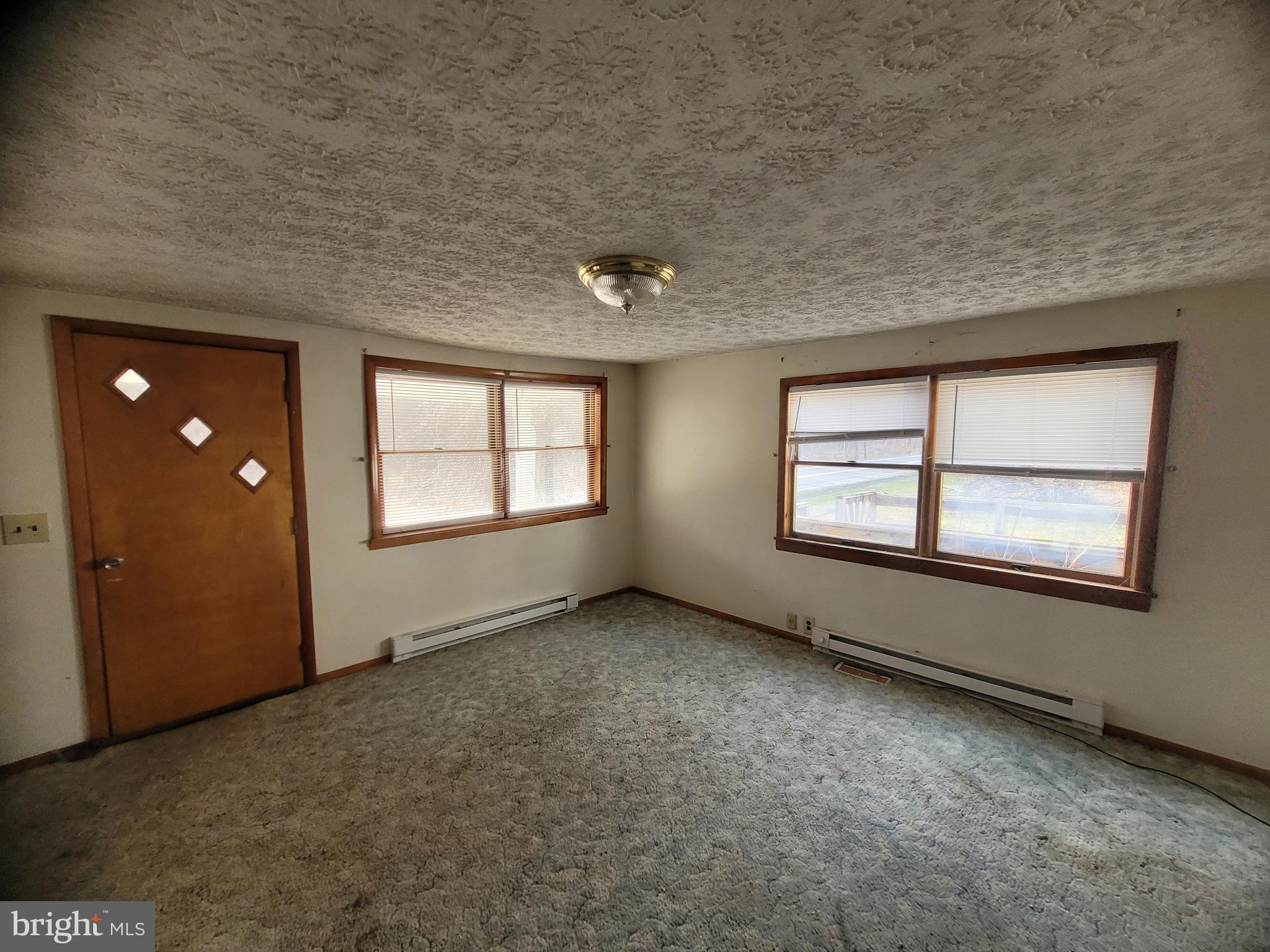 9492 Cumberland Road Springfield, WV 26763 - Photo 22 of 33 an empty room with windows