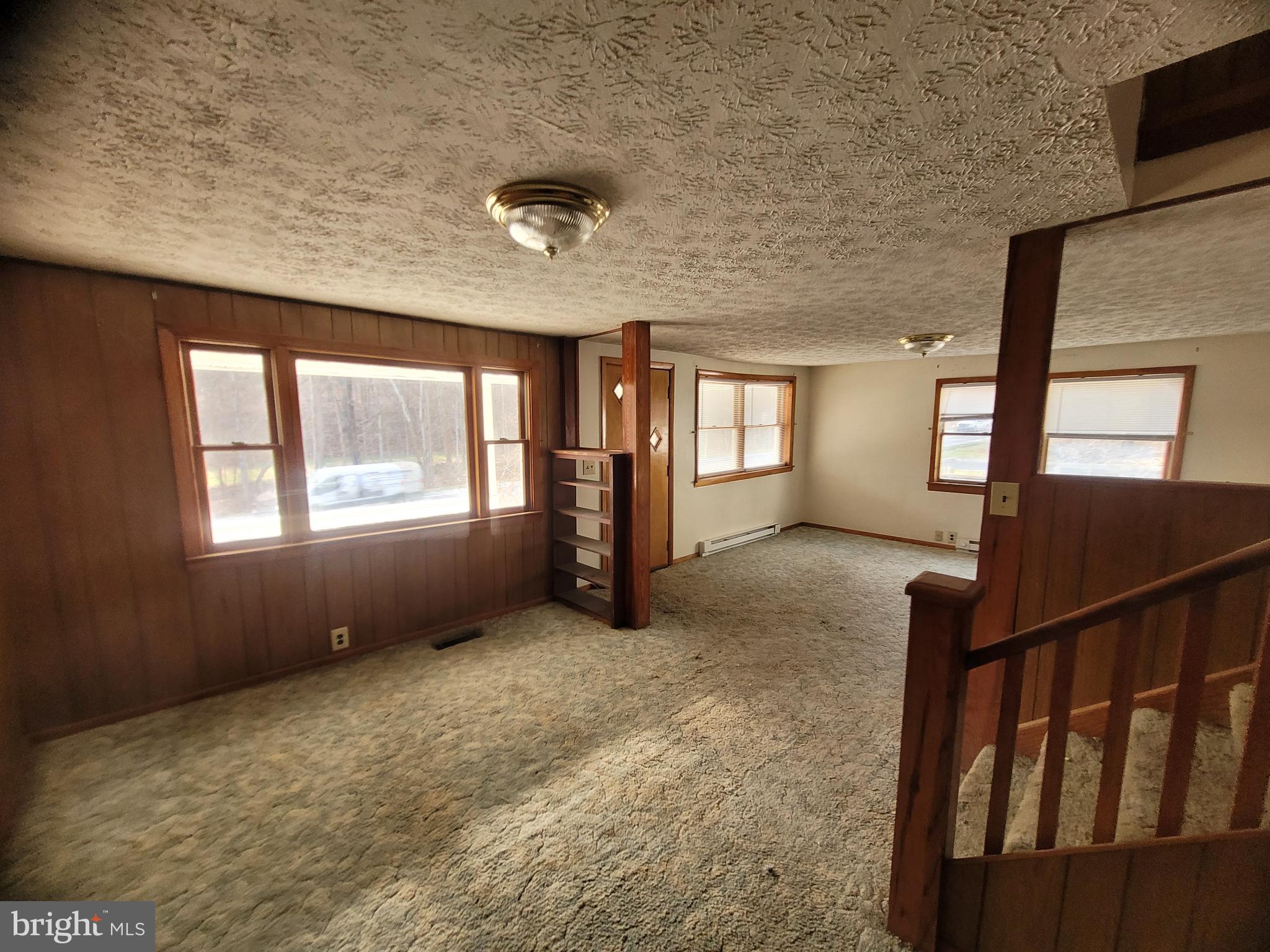 9492 Cumberland Road Springfield, WV 26763 - Photo 24 of 33 wooden floor in an empty room with a window