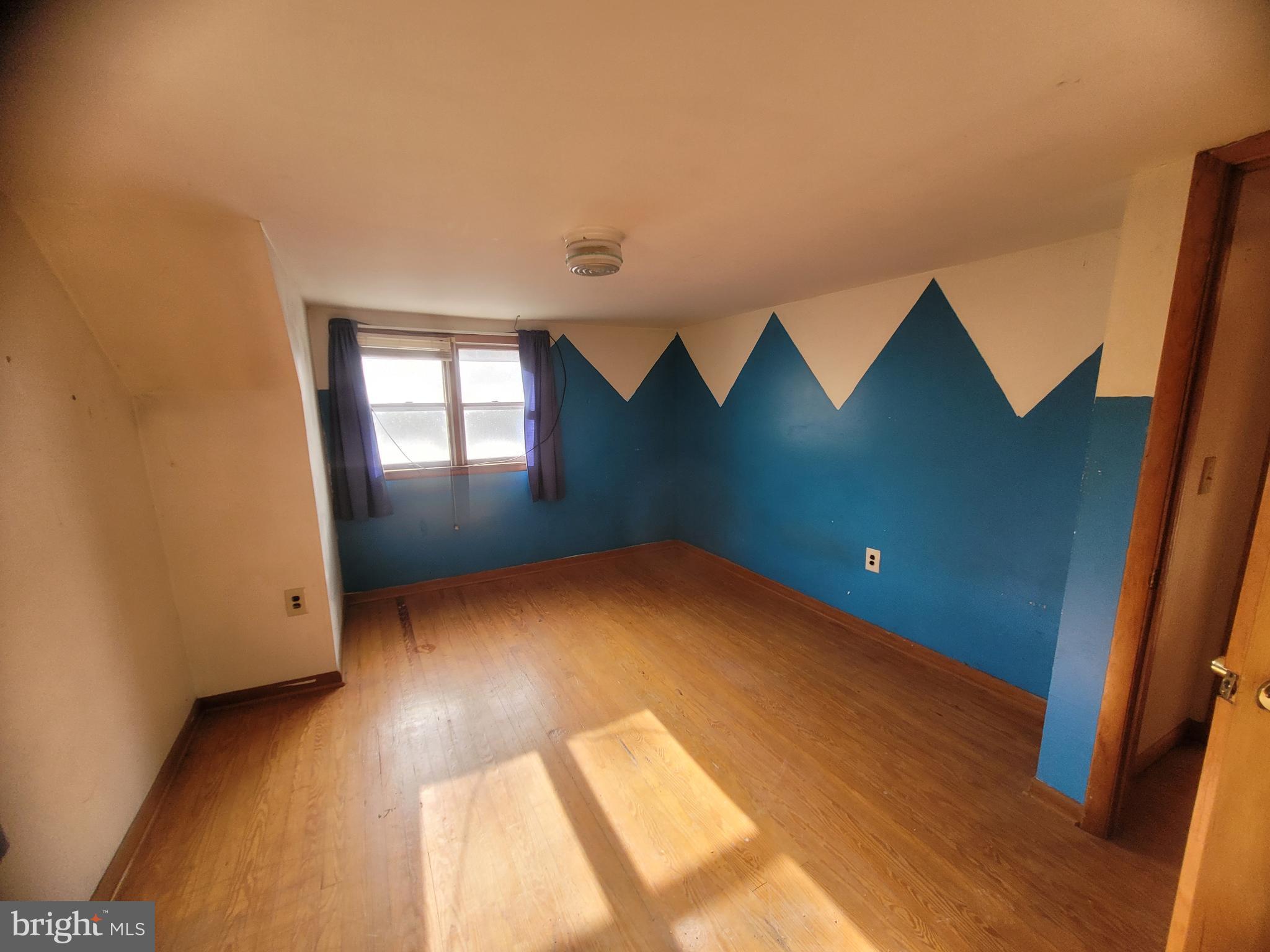 9492 Cumberland Road Springfield, WV 26763 - Photo 31 of 33 wooden floor in an empty room with a window