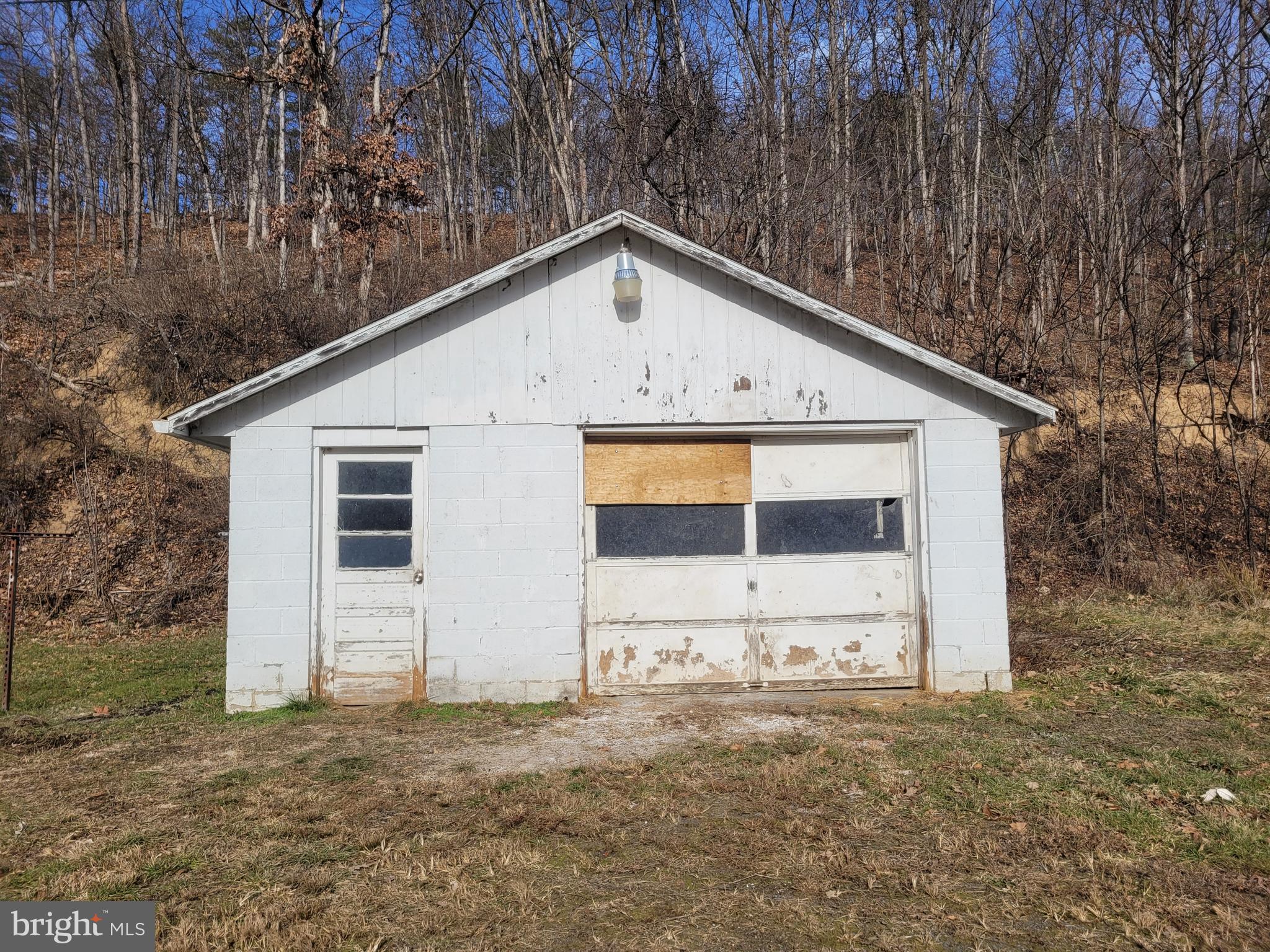 9492 Cumberland Road Springfield, WV 26763 - Photo 7 of 33 a view of a house with large trees
