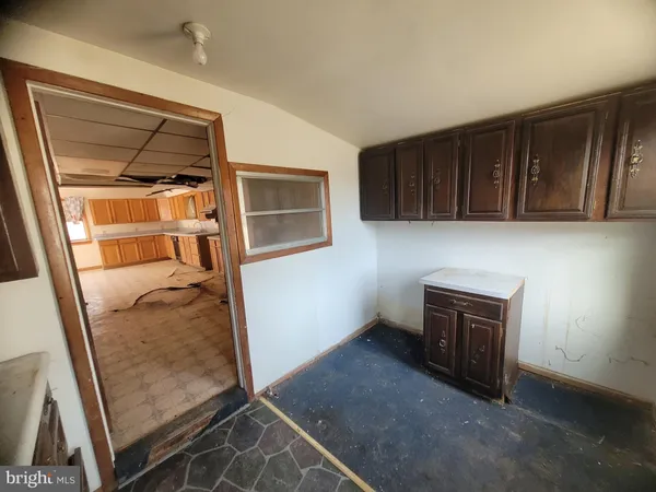a view of an empty room and fire place