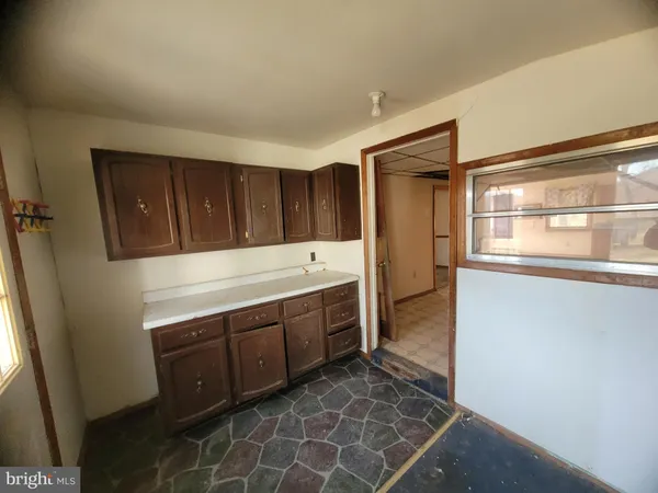a view of cabinets and wooden floor
