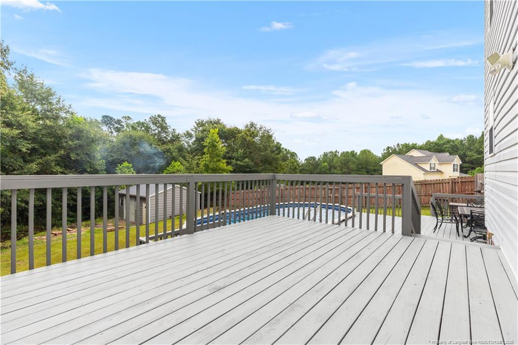 121 Jubilee Court Cameron, NC 28326 - Photo 23 of 36 a view of balcony with wooden floor and fence
