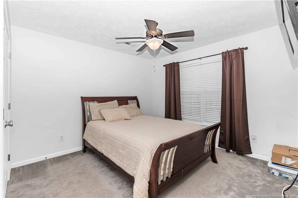 121 Jubilee Court Cameron, NC 28326 - Photo 27 of 36 a bedroom with a bed and window
