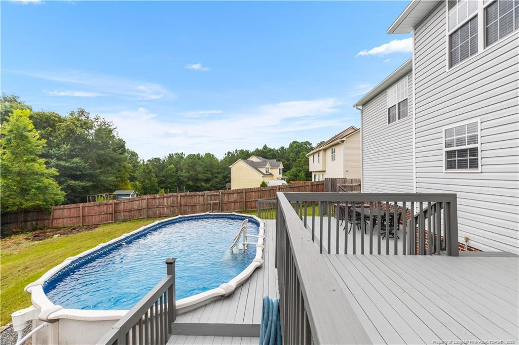 121 Jubilee Court Cameron, NC 28326 - Photo 32 of 36 a view of a wooden deck and a backyard