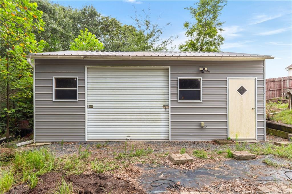 121 Jubilee Court Cameron, NC 28326 - Photo 35 of 36 a view of a house with a small yard