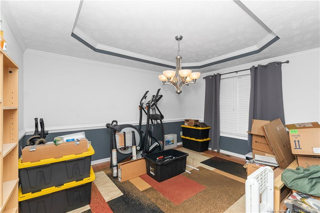 121 Jubilee Court Cameron, NC 28326 - Photo 6 of 36 a view of a workspace with furniture and chandelier