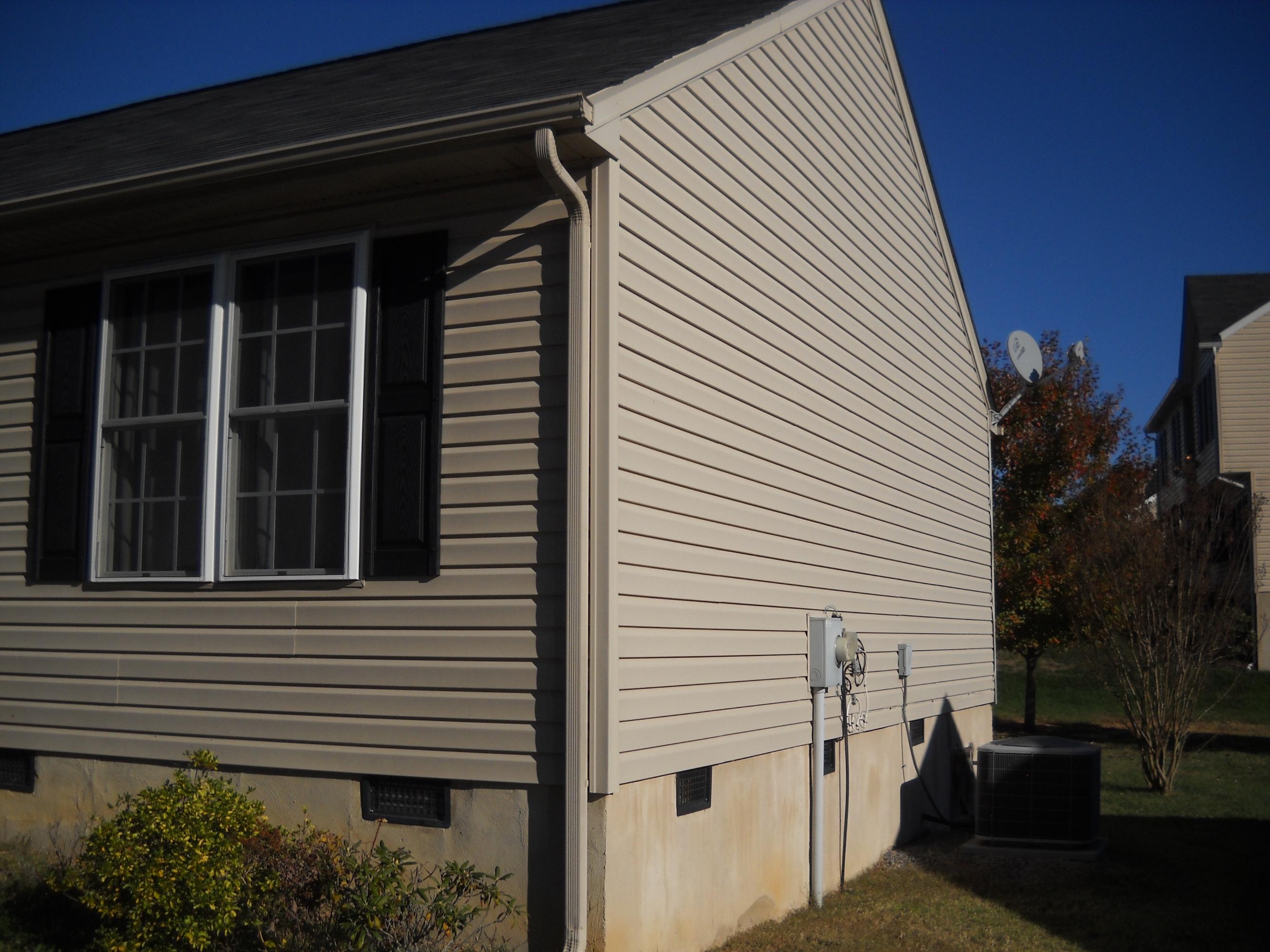 3148 Reed Road Southeast Roanoke, VA 24014 - Photo 5 of 20 a view of a house with a window and brick walls