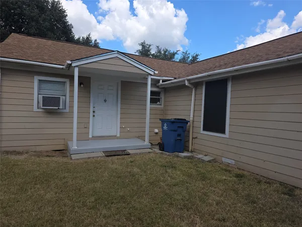 a view of house with an outdoor space