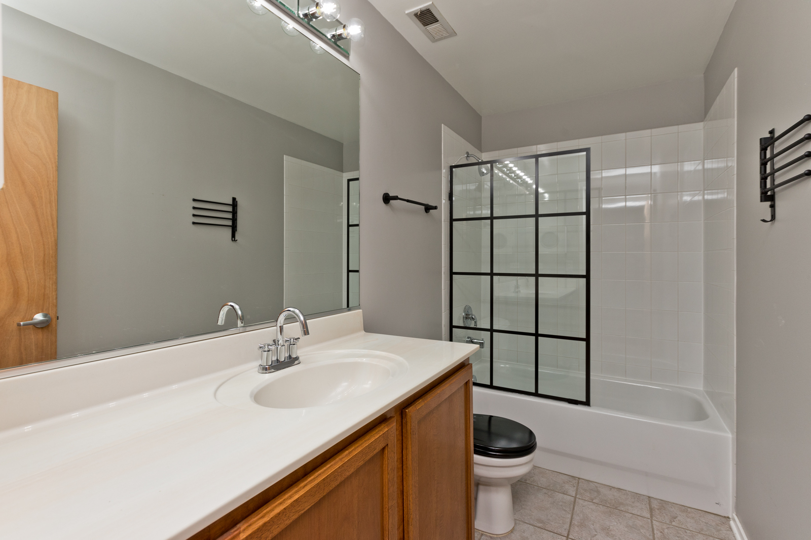 1500 West Monroe Street, Unit 515 Chicago, IL 60607 - Photo 9 of 10 a bathroom with a sink toilet and shower