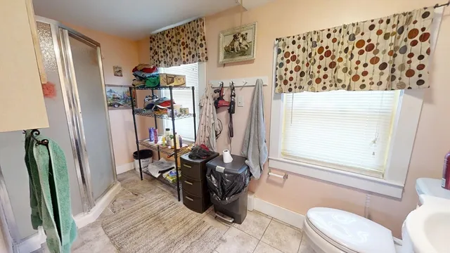 a bedroom with a bed and cabinets