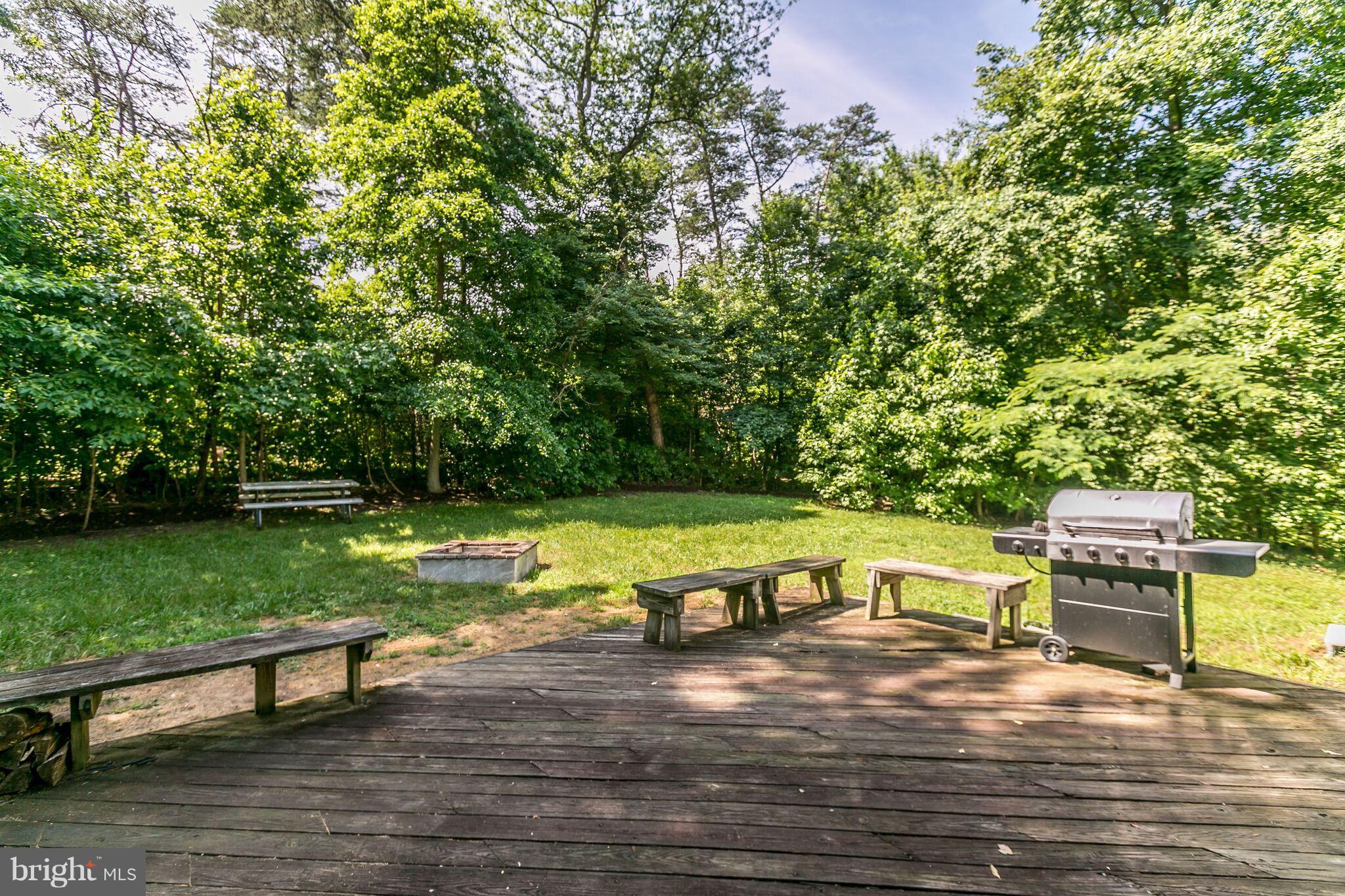 1667 Disney Road Severn, MD 21144 - Photo 25 of 28 Deck overlooking rear yard and fire pit