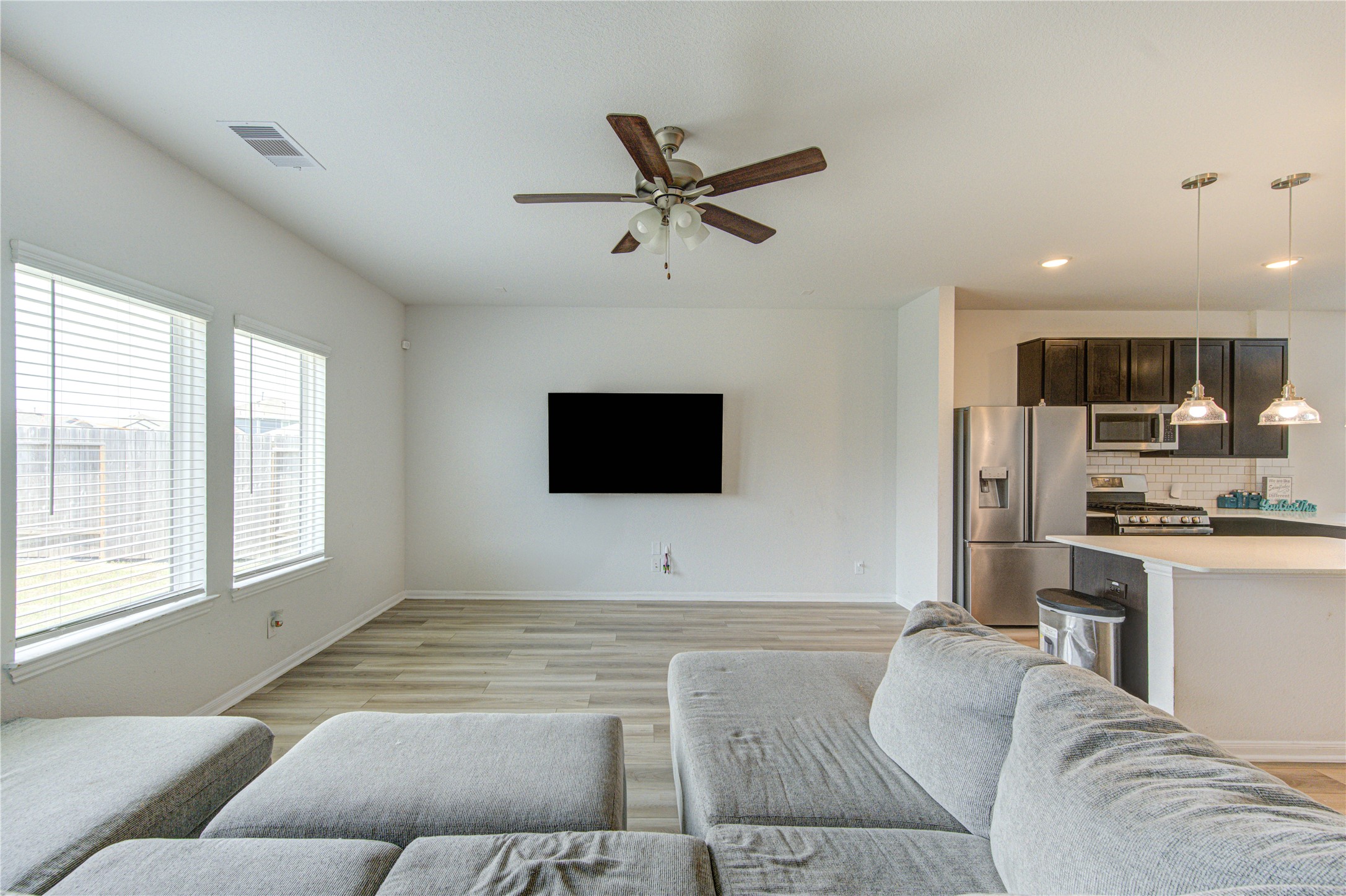 20951 New Proper Drive New Caney, TX 77357 - Photo 7 of 28 a living room with furniture and a flat screen tv