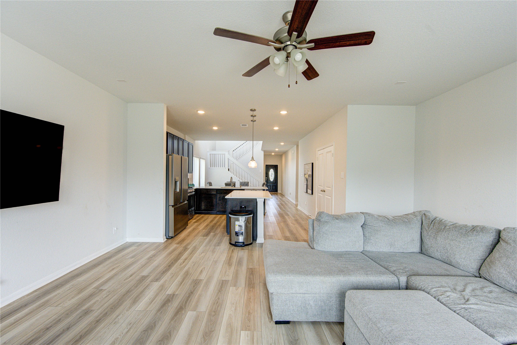20951 New Proper Drive New Caney, TX 77357 - Photo 8 of 28 a living room with furniture and a flat screen tv