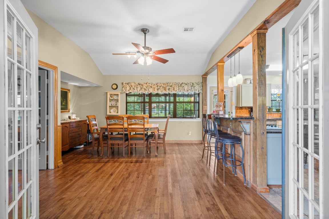 2400 Bowler Road Magnolia, TX 77355 - Photo 12 of 48 a view of a dining room with furniture window and wooden floor