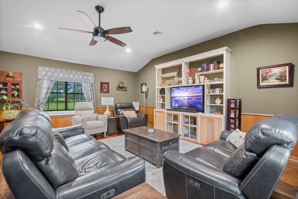 2400 Bowler Road Magnolia, TX 77355 - Photo 19 of 48 a living room with furniture and a flat screen tv