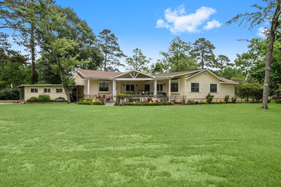 2400 Bowler Road Magnolia, TX 77355 - Photo 2 of 48 a view of house with yard and outdoor seating