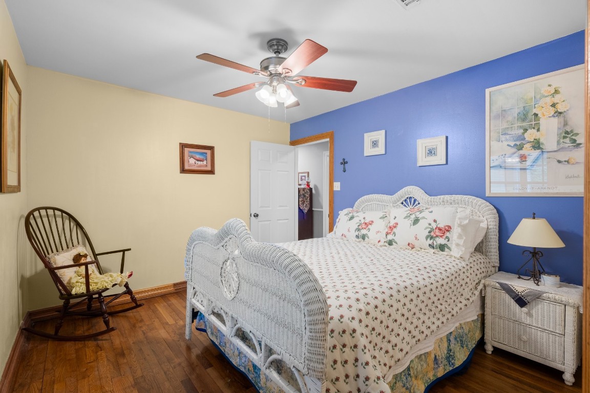 2400 Bowler Road Magnolia, TX 77355 - Photo 22 of 48 a bedroom with a bed and a chandelier