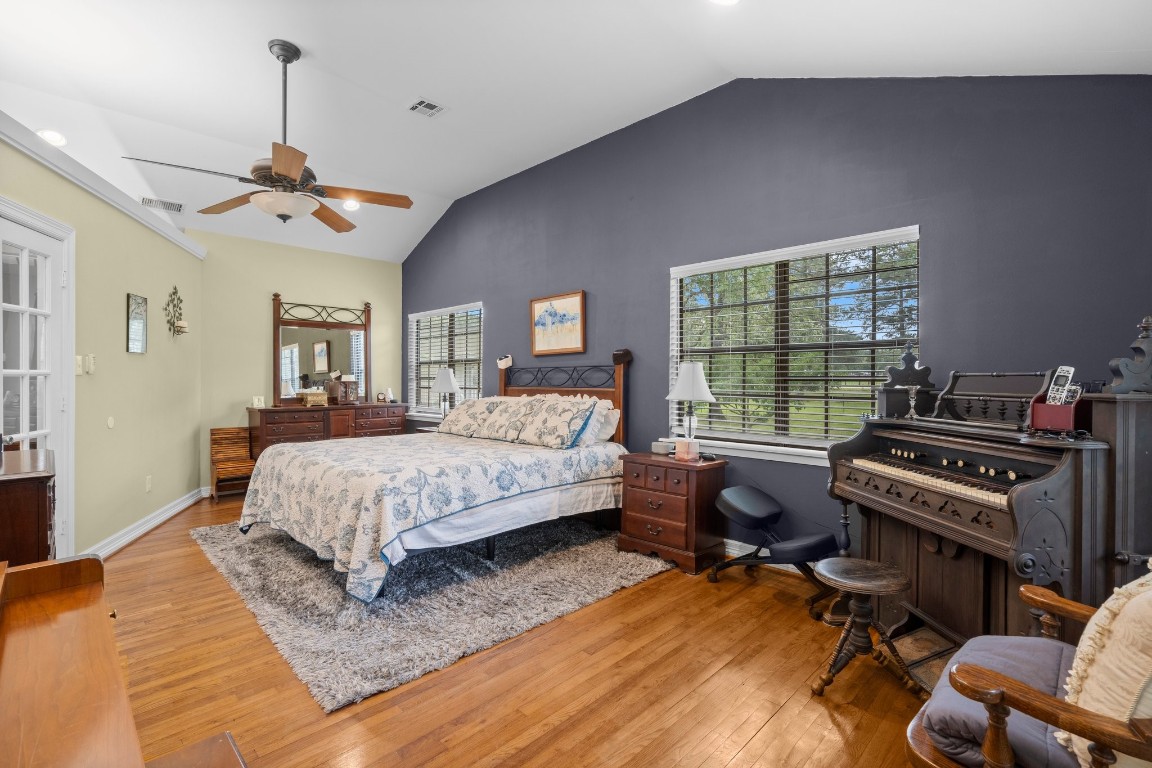 2400 Bowler Road Magnolia, TX 77355 - Photo 25 of 48 a bedroom with a bed gym equipment and a window