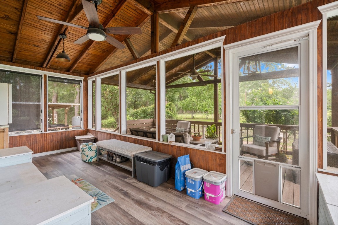 2400 Bowler Road Magnolia, TX 77355 - Photo 30 of 48 a living room with furniture and floor to ceiling windows
