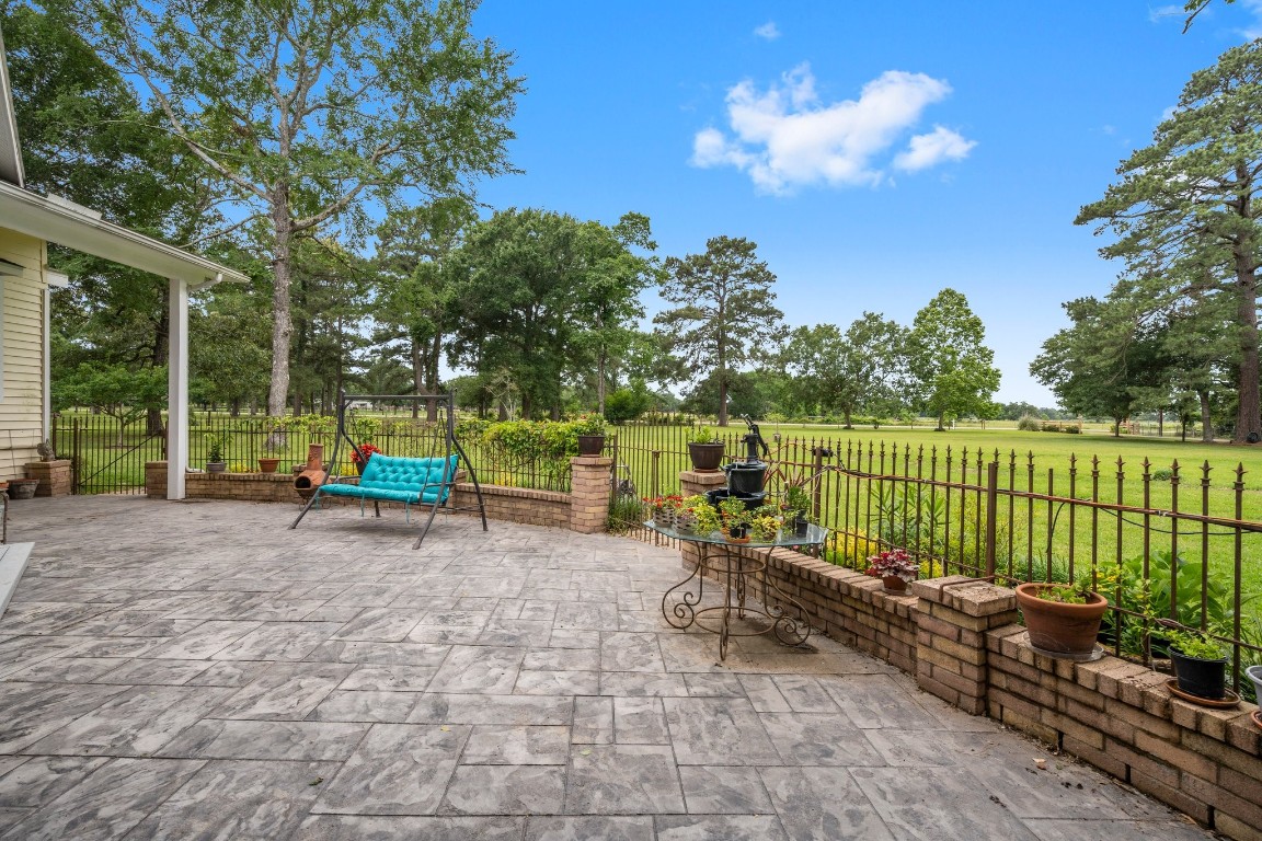 2400 Bowler Road Magnolia, TX 77355 - Photo 3 of 48 a view of a chair and tables in the patio