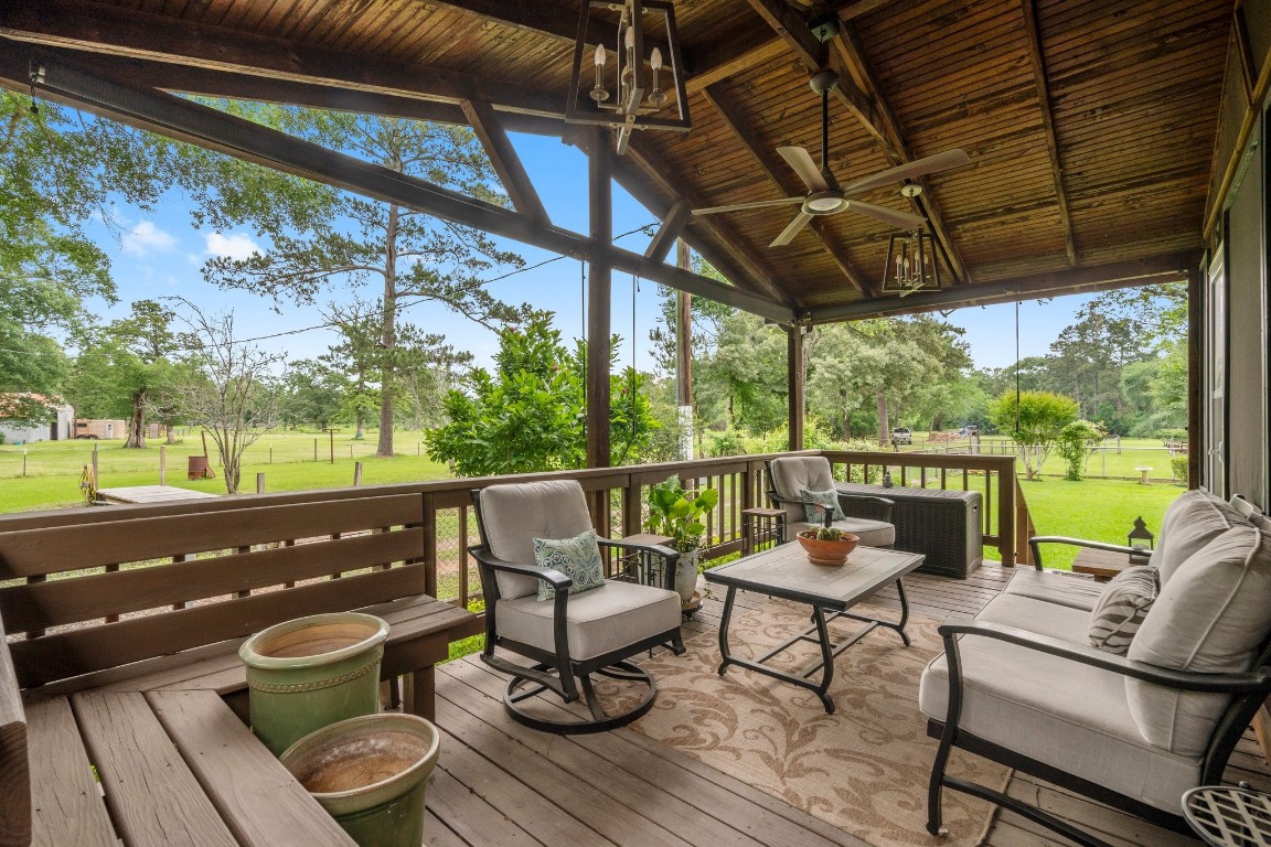 2400 Bowler Road Magnolia, TX 77355 - Photo 31 of 48 a balcony with wooden floor and outdoor seating