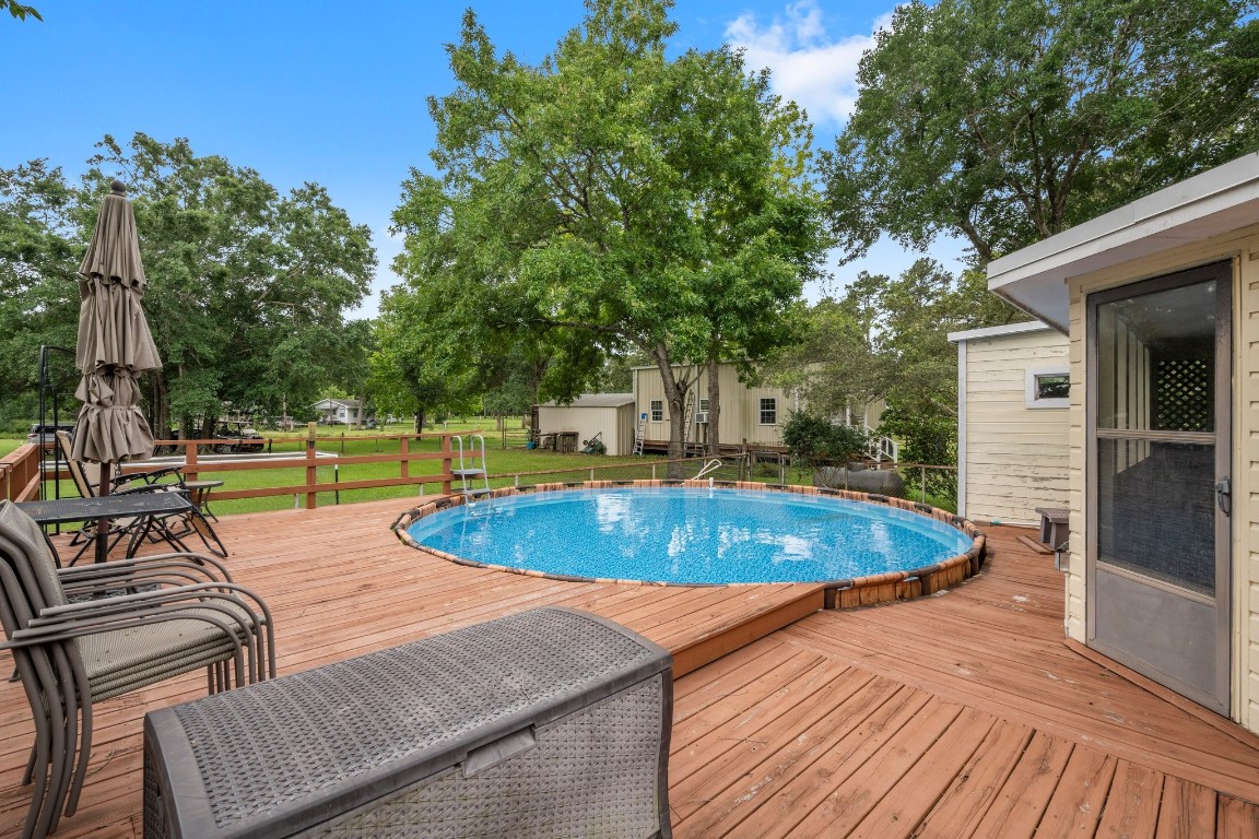 2400 Bowler Road Magnolia, TX 77355 - Photo 33 of 48 a view of a swimming pool with a patio