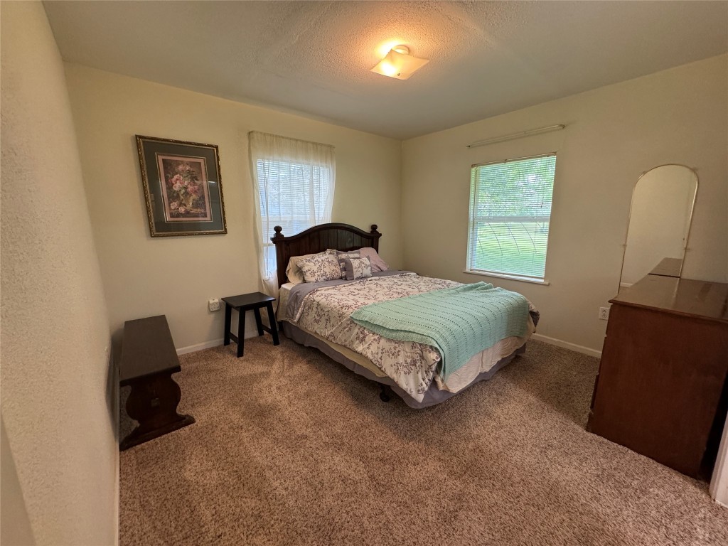 2400 Bowler Road Magnolia, TX 77355 - Photo 45 of 48 a bedroom with a bed and a couch