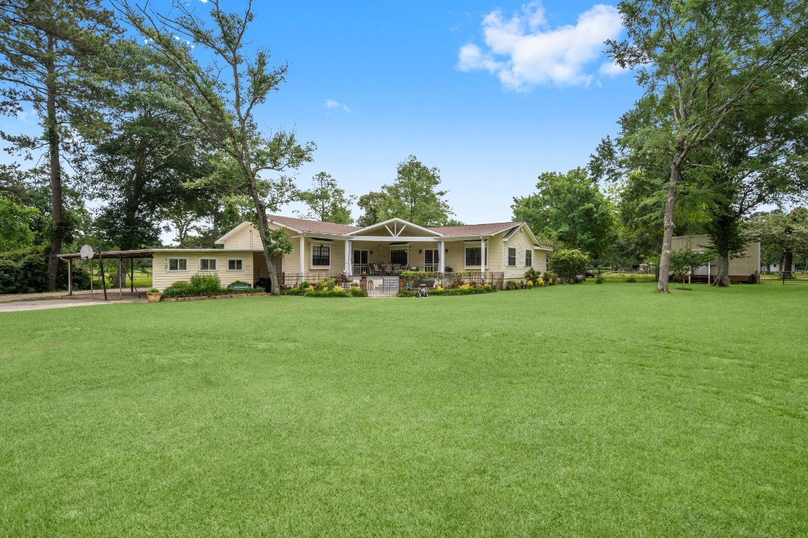 2400 Bowler Road Magnolia, TX 77355 - Photo 8 of 48 a view of house that has a yard