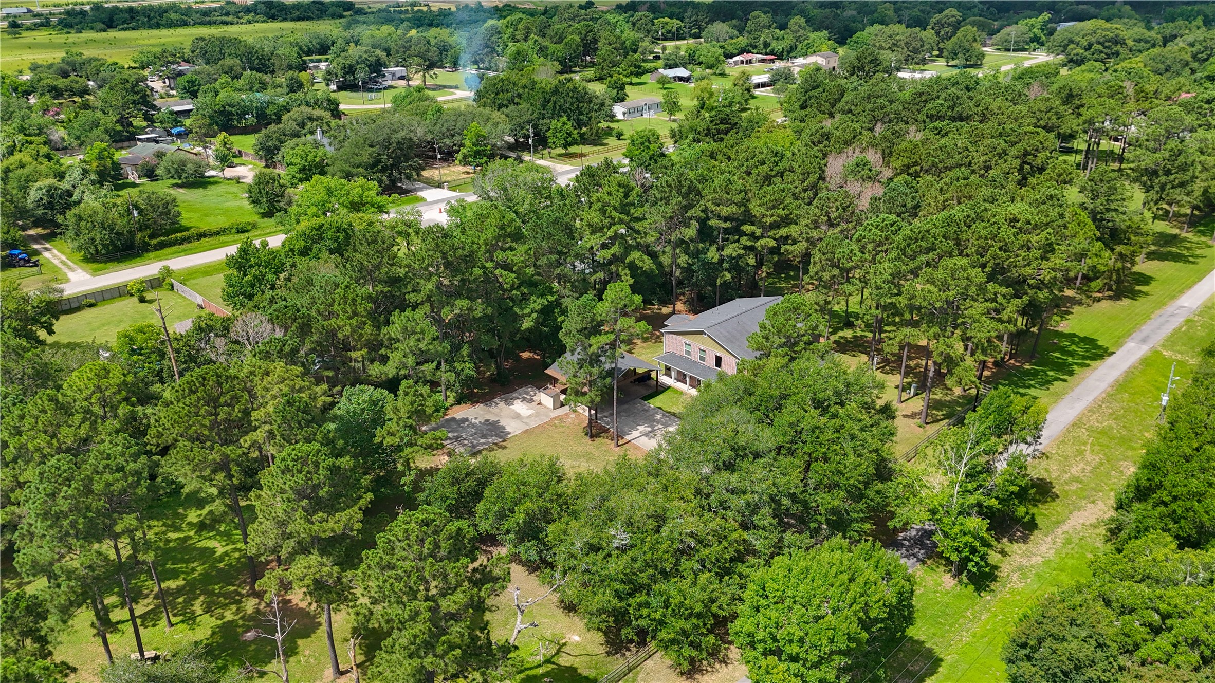 20531 Faye Tomball, TX 77377 - Photo 10 of 43 a view of a house with a lush green forest