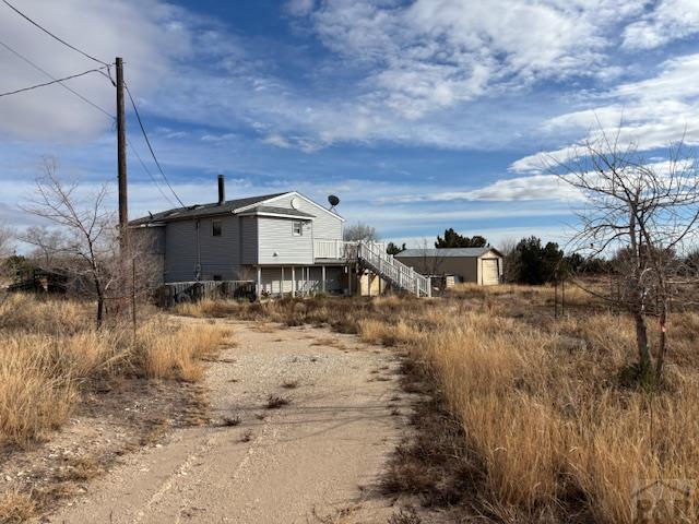 490 A Street Penrose, CO 81240 - Photo 1 of 46 a view of a house with a snow on the road