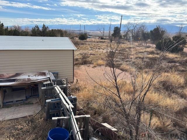 490 A Street Penrose, CO 81240 - Photo 12 of 46 a backyard of a house with table and chairs