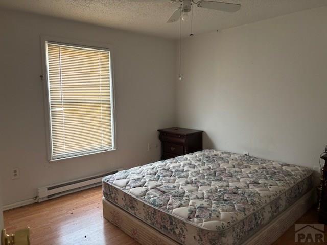 490 A Street Penrose, CO 81240 - Photo 23 of 46 a bed sitting in a bedroom next to a window