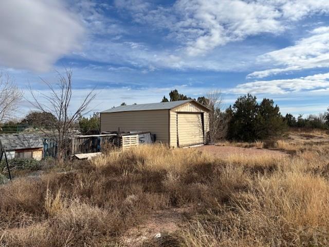 490 A Street Penrose, CO 81240 - Photo 8 of 46 a view of a house with a yard and wooden fence