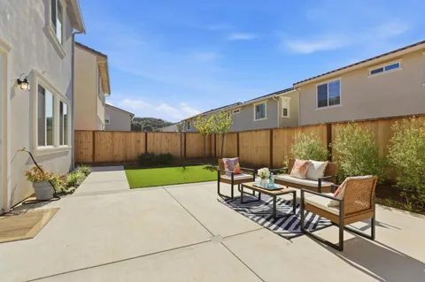a outdoor space with patio furniture and windows