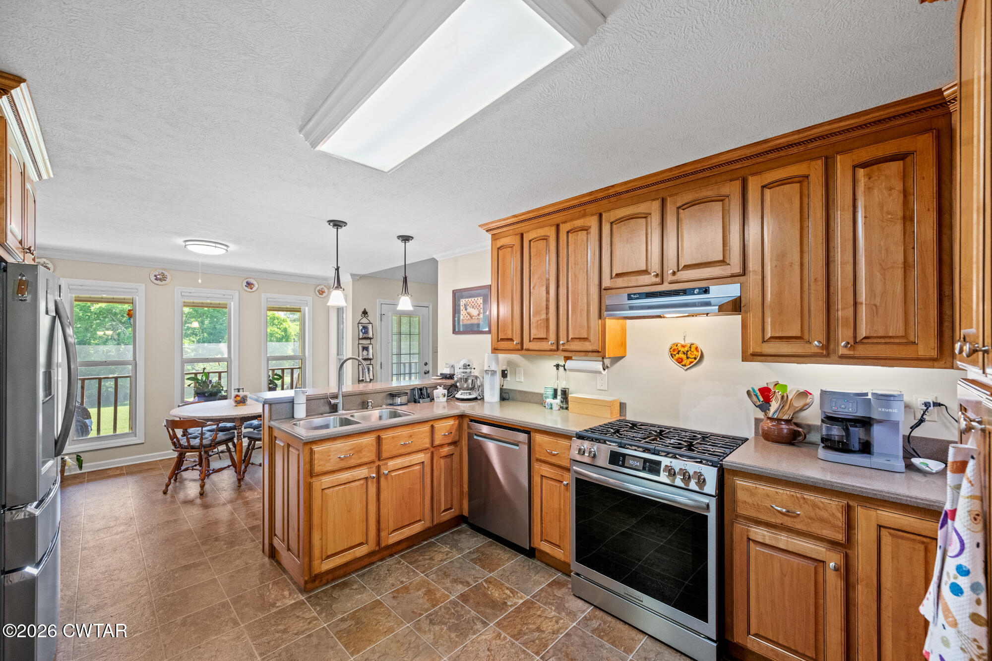 492 Joe Horton Road Lexington, TN 38351 - Photo 13 of 49 a kitchen with a sink stove and cabinets