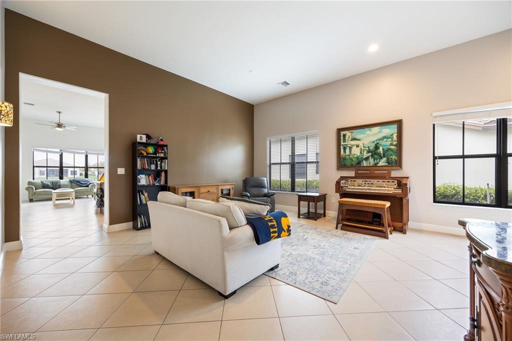 5116 Salerno Street Ave Maria, FL 34142 - Photo 4 of 36 Living area with a ceiling fan and light tile patterned floors