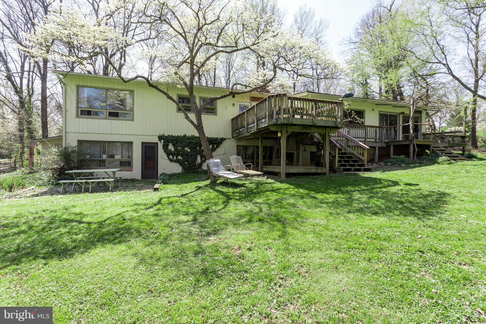 1780 Proffit Road Vienna, VA 22182 - Photo 13 of 21 a view of a house with a yard porch and a large tree