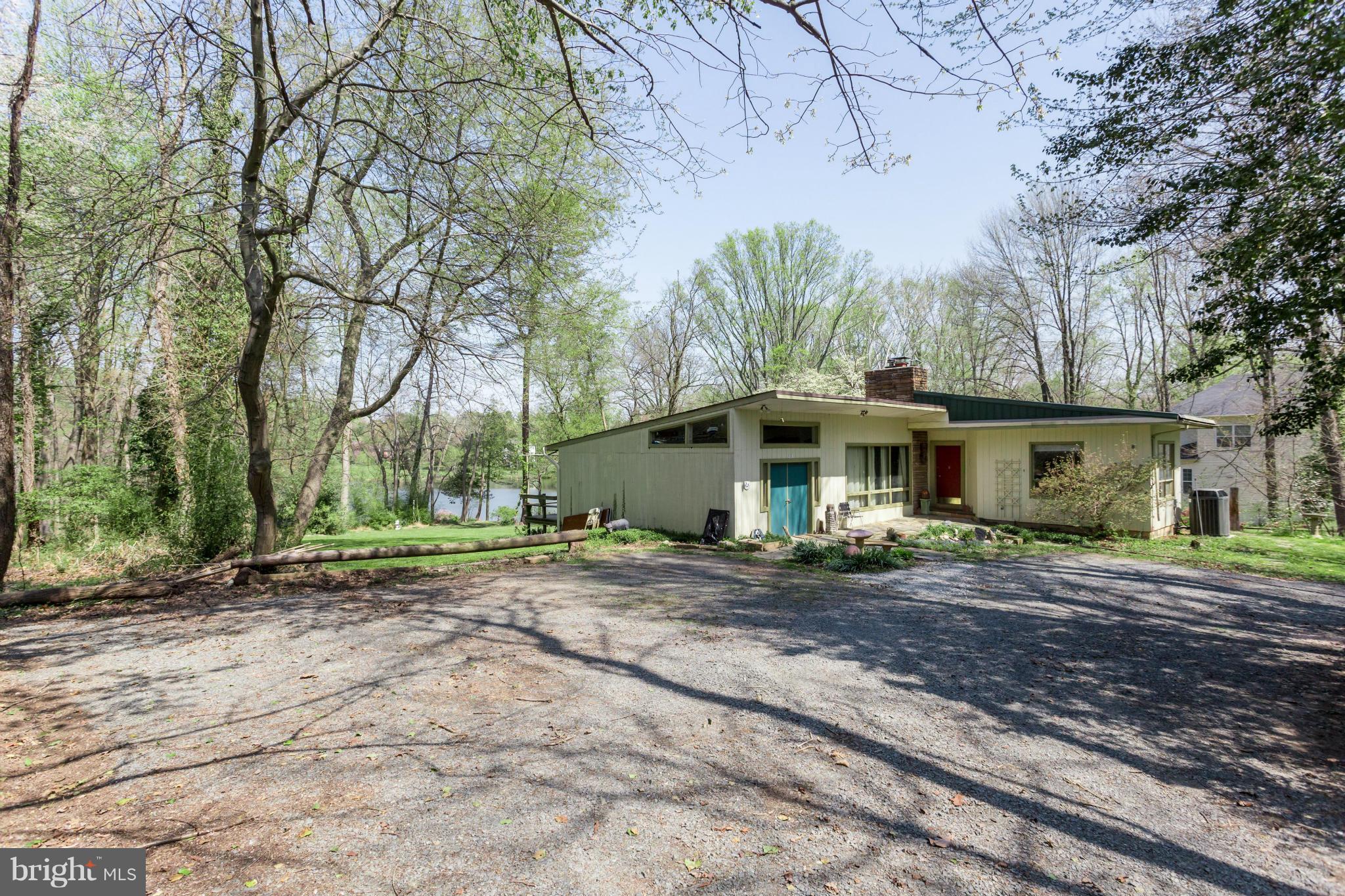 1780 Proffit Road Vienna, VA 22182 - Photo 15 of 21 a front view of a house with a garden