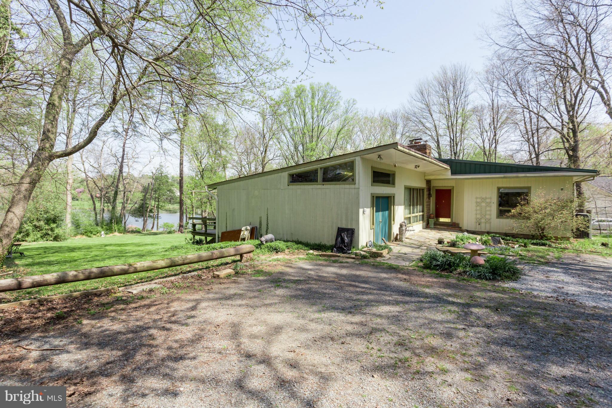 1780 Proffit Road Vienna, VA 22182 - Photo 16 of 21 a view of a house with backyard and trees