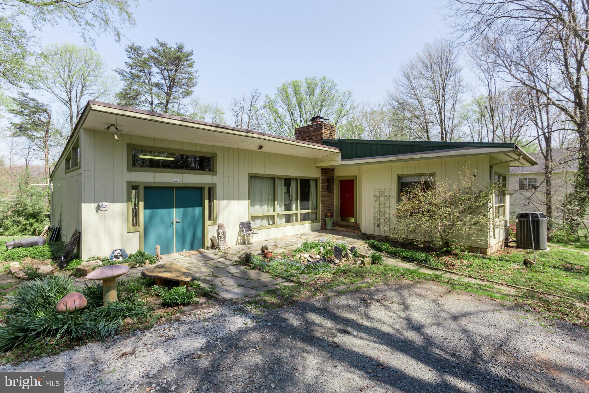 1780 Proffit Road Vienna, VA 22182 - Photo 17 of 21 a front view of a house with garden